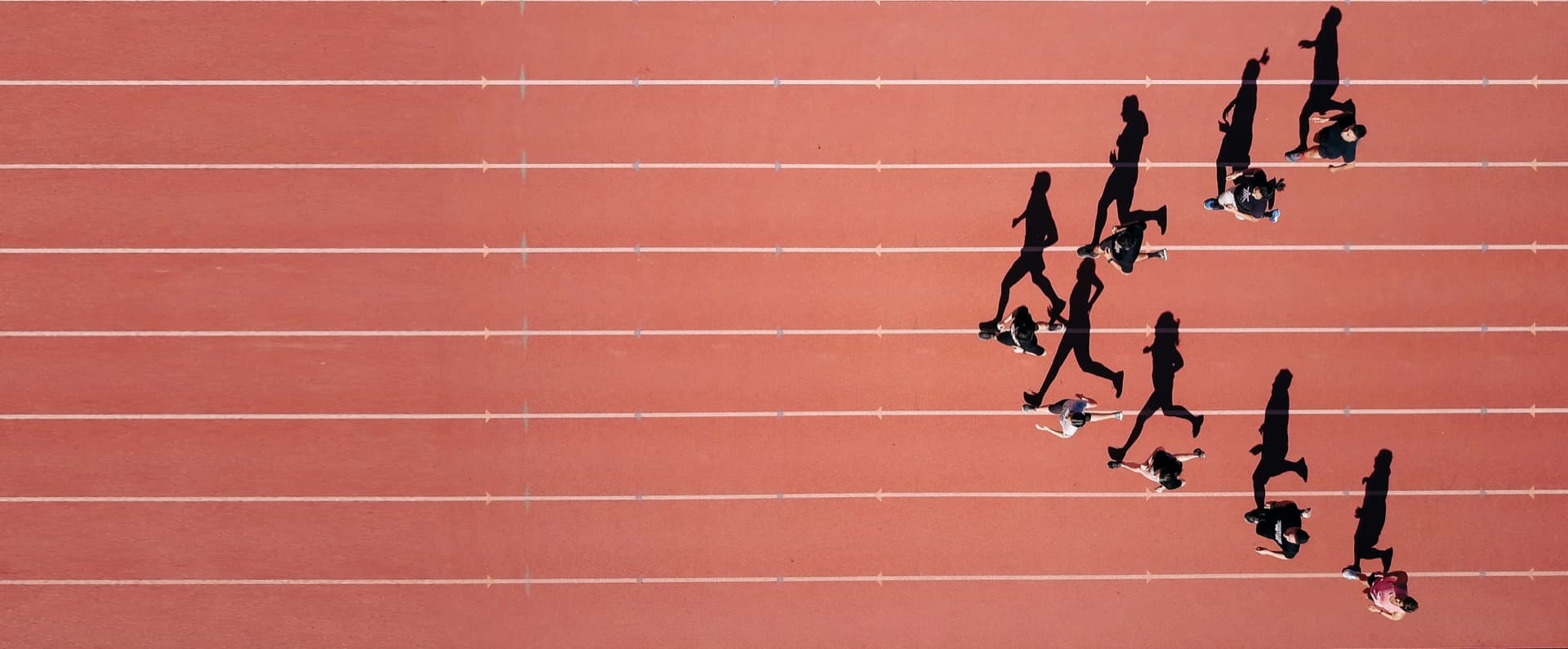 Runners on stadium track